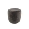 Dark grey plush round ottoman detail, soft furry floor pouf texture close-up view. - Gray