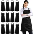 Black polyester kitchen work aprons 12pcs pack with pockets and adjustable neck strap. - Polyester (Pack of 12) / Black