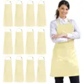 Close-up view of the light yellow polyester work apron featuring a front pocket and neck strap. - Polyester (Pack of 12) / Khaki