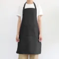 Tablier bavette imperméable noir avec deux poches pour cuisine, restaurant et travail. - Noir
