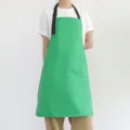 Tablier de cuisine vert avec bretelles noires réglables et poches avant pour le travail. - Vert