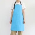 Tablier de cuisine imperméable avec lanière de cou réglable et poches avant pour le travail. - Bleu clair