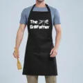 Black kitchen cooking apron with funny letter print and pocket, durable fabric for men and women. - THE Black