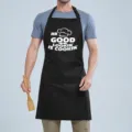 Black cotton kitchen cooking apron with funny quote, adjustable neck strap and front pocket. - COOKIN Black