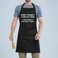 Black cotton kitchen apron with funny YouTube text slogan, adjustable neck strap and pocket. - WORRY Black