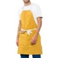 Tablier de cuisine en toile jaune avec bretelles blanches, idéal pour la pâtisserie et le service. - Jaune