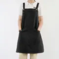 Black cotton canvas apron with pockets, perfect for kitchen cooking, restaurant service work. - Black