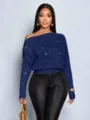 Detail view of the stylish dark blue off-shoulder sequin knit sweater with batwing sleeves. - S / Blue