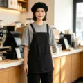 Schwarze wasserdichte Arbeitskochung Schürze für Küche und Café mit praktischen Vordertaschen. - Schwarz