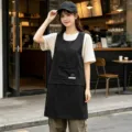 Professional black work apron with pockets, ideal for restaurant, cafe and kitchen staff use. - Two-Way Utility Style / Black