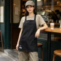 Professional black canvas work apron with multiple pockets for coffee shop barista and kitchen. - Webbing Utility Style / Black