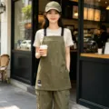 Green canvas work apron with multiple pockets, stylish and durable for coffee shop and restaurant staff. - Webbing Utility Style / Army Green