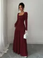 Detailed view of the burgundy textured long-sleeve maxi dress focusing on details. - S / Burgundy