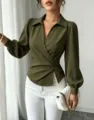 Green lapel V-neck wrap waist shirt detail showing elegant crossover design and long sleeves. - Army Green