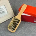 Wooden paddle hair brush with wooden pins and air cushion design for daily hair care and anti-static. - Square Handle Black Coating