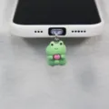 Detailed close-up view of a cute green frog phone charm holding heart, phone tether tab accessory. - Green / Suitable for Type-C Interface