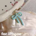 Detailed view of cute light blue bow phone dust plug pendant for iPhone charming accessory. - Style 2 / iOS Phone (Lightning)