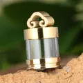Close-up of the openable titanium steel hollow pendant detail, showcasing crystal container. - Single Pendant (Gold)