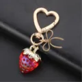 Porte-clés fraise en cristal avec fermoir cœur et nœud élégant pour accessoire de sac. - Style 3