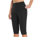 Close-up view of women's black high-waist yoga capris featuring practical side pockets. - S / Bottoms / Brown