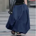 Detail view of a long navy blue A-line maxi skirt, high waist and flowing design for daily wear. - Dark Blue