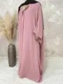 Detailed view of the elegant loose batwing sleeve maxi dress in soft pink tone with hijab. - S / Dresses / Pink