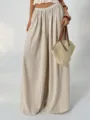 Beige crinkled wide leg pants featuring high elastic waist and elegant draping effect. - Apricot
