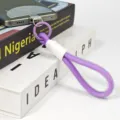 Purple braided phone strap wrist lanyard with white accent and ring clip for mobile phone. - Lanyard with Gasket 7