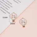 Detailed close-up of pink and white enamel hot air balloon alloy DIY jewelry charms. - 2# Hot Air Balloon