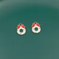 Close-up detail of Christmas wreath metal charms with red bows for DIY jewelry making. - Christmas Series / 10# Wreath
