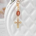 Alloy rhinestone cross keychain bag charm, elegant religious pearl pendant accessory. - Red