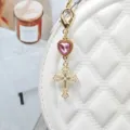 Gold alloy keychain with pink heart crystal and pearl cross pendant, stylish bag charm accessory. - Style 11