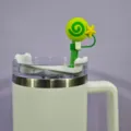 Detailed shot of cute green lollipop straw cover with star, reusable silicone dust cap accessory. - Style 1