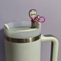 Close-up detail of a cute pink medical stethoscope silicone straw cover accessory on a tumbler. - Figure 9 (Straw and Cup Not Included)