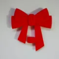 Red silicone bow straw topper detail shot, dust plug accessory for 10mm tumbler straws. - Red