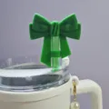 Green silicone bow straw topper for 10mm tumblers, cute dust-proof straw cover accessory. - Green