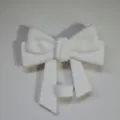 White silicone bow straw cover detail, showcasing the fine texture and stable base structure. - White