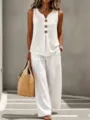 Detailed shot of women's white linen two-piece set featuring V-neck button top and wide-leg pants. - S / Top And Bottom / White