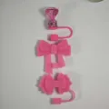 Pink silicone straw covers and cute bow dust plugs, perfect tumbler cup accessories. - Pink
