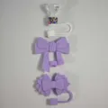 Silicone straw covers detail shot, decorative bow and diamond tumbler accessories. - Purple