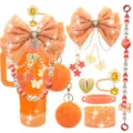 Set di accessori per tazza arancione con fiocco, catenina, pompon e copertura. - Combinazione 6