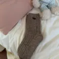 Brown knit wool socks for women, thick warm winter crew socks with cute button detail. - One Size / Mocha