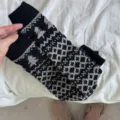 Cozy black and grey knitted Fair Isle leg warmers with Nordic geometric tree patterns. - Black