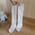 Solid white knee high socks, casual athletic long stockings, comfortable daily wear variant. - One Size / Pure White