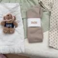 IOULOR Korean style cute slouch knee high socks for women, soft solid color long socks. - One Size / Milk Tea