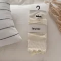IOULOR sweet knitted leg warmers, beige solid color ruffle boot cuffs for women fashion. - Cream