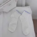 White mid-tube socks for women featuring cute blue ruffle trim, soft comfortable daily wear. - One Size / White Blue Edge