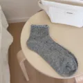 Grey women's short socks with cute frilly lace trim and subtle polka dot pattern. - Gray