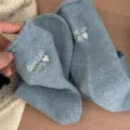 Blue wool blend knit socks with cute embroidered text and cozy rolled cuffs for winter. - One Size / Fog Blue