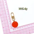 Detail shot of the metal basketball keychain pendant, showing compact size and 5.4g weight. - Basketball